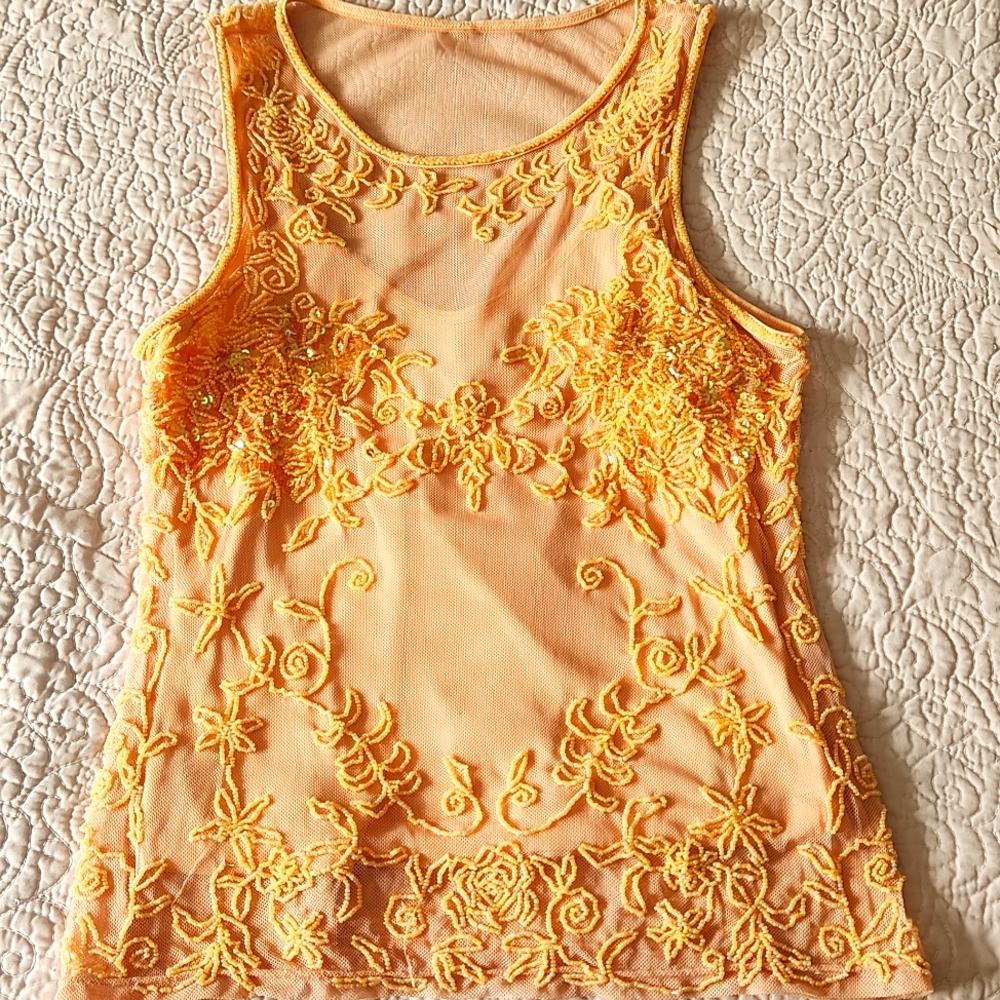 Intricate beaded peach colored top. Beautiful detail.